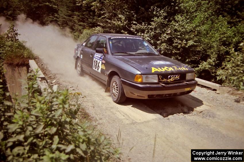 Jerry Cuffe / Barry Cuffe Audi 80 Quattro at speed over a bridge on SS5, Magalloway North.