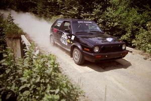 Charles Sprigg / Andy Jones VW GTI at speed over a bridge on SS5, Magalloway North.