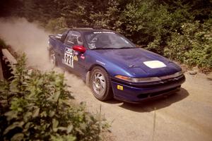 Howie Richards / Joel Richards Mitsubishi Eclipse at speed over a bridge on SS5, Magalloway North.