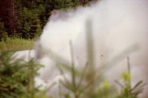 Stig Blomqvist / Lance Smith Ford Escort Cosworth RS powers through a corner on SS8, Parmachenee Long.