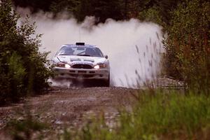 Noel Lawler / Charles Bradley Hyundai Tiburon splashes through a puddle on SS8, Parmachenee Long.