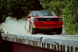 Sylvester Stepniewski / Adam Pelc Audi 4000 Quattro hops onto a bridge on SS8, Parmachenee Long.