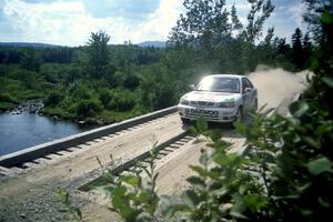 Peter Malaszuk / Darek Szerejko Daewoo Nubira at speed over a bridge on SS8, Parmachenee Long.