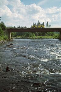 Scott Kreisler / John Bonasera Nissan 200SX at speed over a bridge on SS8, Parmachenee Long.