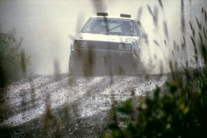 Eric Burmeister / Mark Buskirk VW GTI splashes through a puddle on SS8, Parmachenee Long.