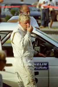 Stig Blomqvist (background) and Lance Smith (foreground) and their Ford Escort Cosworth RS
