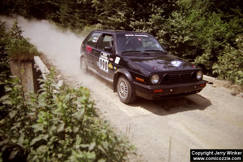 Charles Sprigg / Andy Jones VW GTI at speed over a bridge on SS5, Magalloway North.