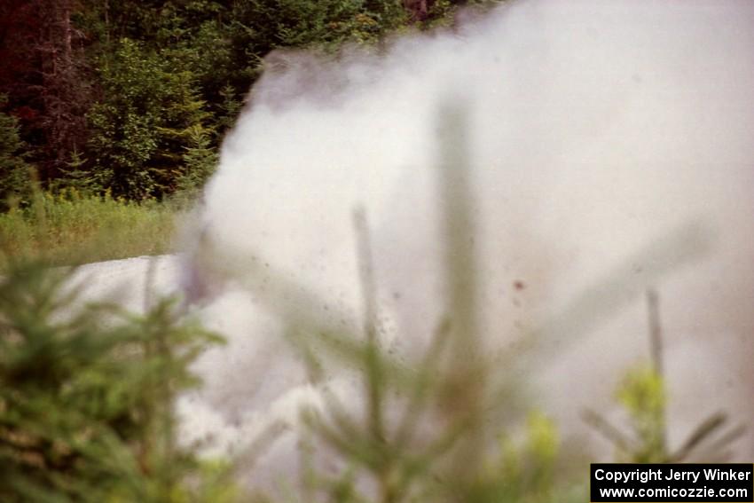 Stig Blomqvist / Lance Smith Ford Escort Cosworth RS powers through a corner on SS8, Parmachenee Long.