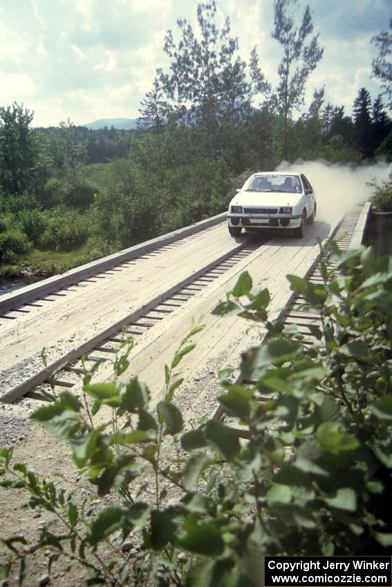 Henry Krolikowski / Cindy Krolikowski Dodge Shadow at speed over a bridge on SS8, Parmachenee Long.