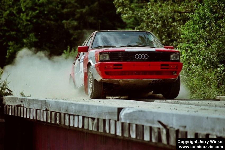 Sylvester Stepniewski / Adam Pelc Audi 4000 Quattro hops onto a bridge on SS8, Parmachenee Long.