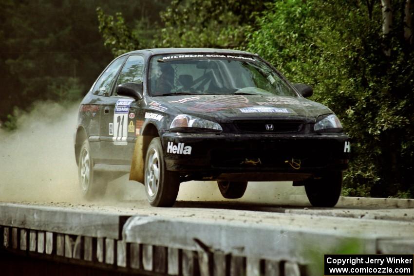Bryan Hourt / Pete Cardimen Honda Civic hops onto a bridge on SS8, Parmachenee Long.