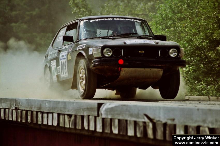 Jerry Sweet / Stuart Spark SAAB 99EMS hops onto a bridge on SS8, Parmachenee Long.