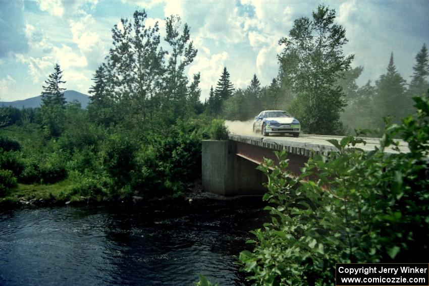 Celsus Donnelly / Kevin Mullan Eagle Talon TSi at speed over a bridge on SS8, Parmachenee Long.