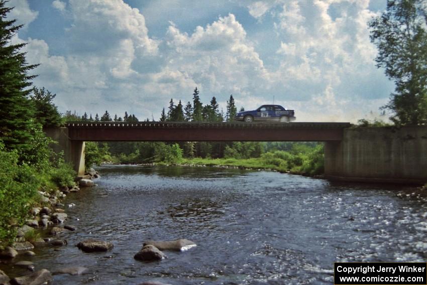 Kendall Russell / John Dillon Dodge Shadow at speed over a bridge on SS8, Parmachenee Long.