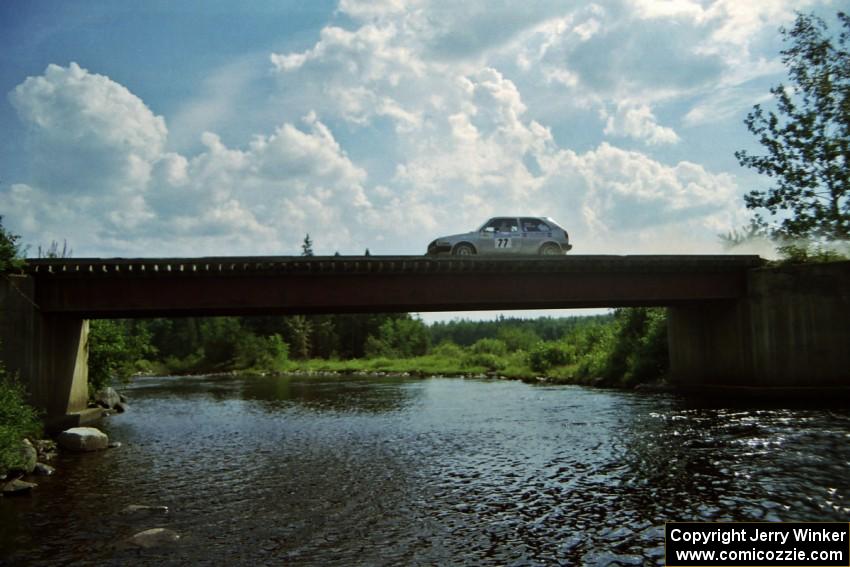 Robert Pao / Bob Barrall VW GTI at speed over a bridge on SS8, Parmachenee Long.