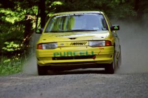 Padraig Purcell / Patrick McGrath Ford Escort GT at speed on the practice stage.