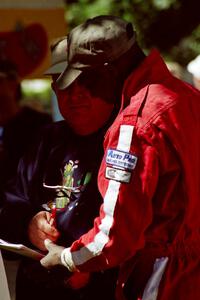 Arthur Odero-Jowi signs an autograph at the green in Wellsboro before the rally.