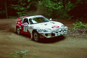 Ralph Kosmides / Joe Noyes Toyota Supra Turbo powers out of a hairpin on SS5, Thompson Point I.