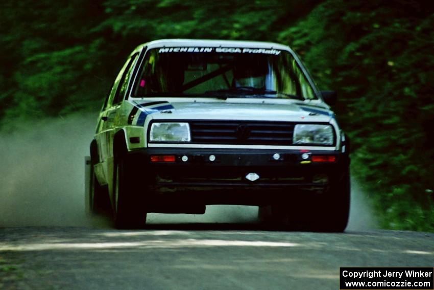 Eric Burmeister / Mark Buskirk VW GTI at speed on the practice stage.