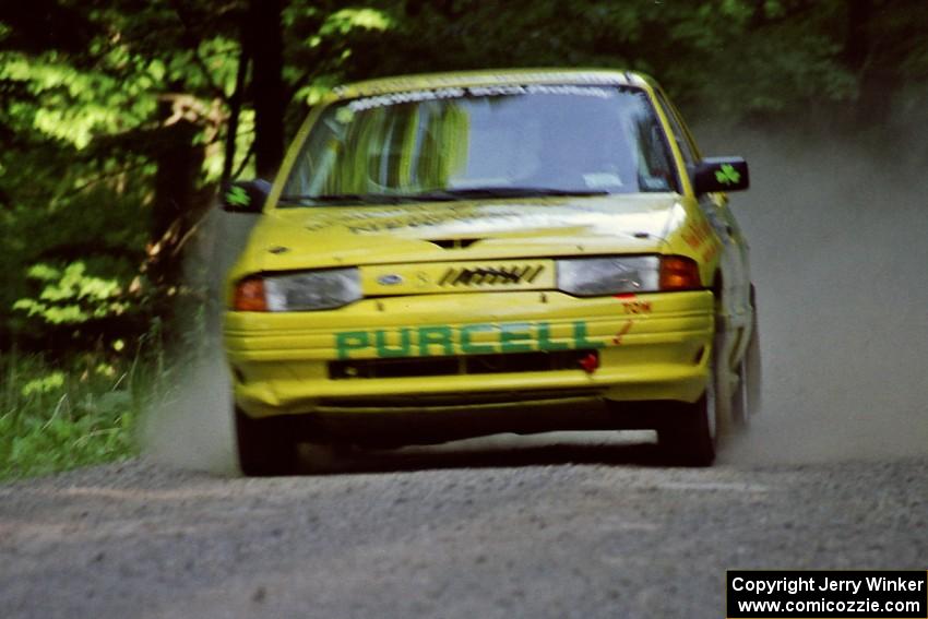 Padraig Purcell / Patrick McGrath Ford Escort GT at speed on the practice stage.
