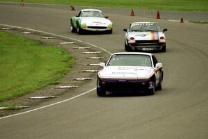 Joe Rothman's ITS Porsche 944, Bill Tapper's ITS Datsun 240Z and Mark Knepper's SSZ Stradale through turn 9