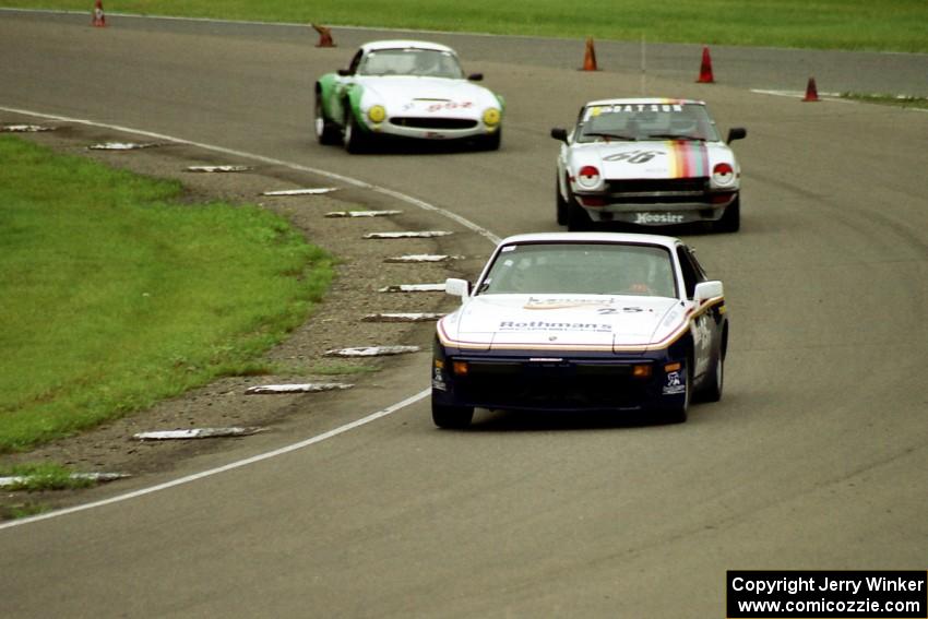 Joe Rothman's ITS Porsche 944, Bill Tapper's ITS Datsun 240Z and Mark Knepper's SSZ Stradale through turn 9