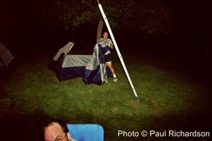 Jerry Winker tries to assemble his tent in the wee hours of the morning. Paul Schwerin is in the foreground.