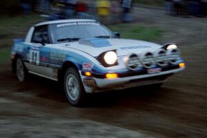 The Mike Hurst / Rob Bohn Mazda RX-7 at speed at the sweeper at the crossroads.
