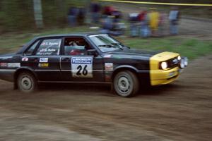 Mike Burke / Craig Belcher go a little wide at the crossroads spectator location in their Audi 4000 Quattro.