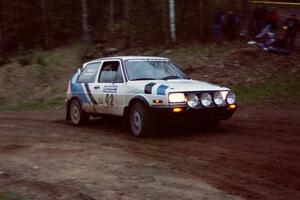 Eric Burmeister / Mark Buskirk drift through the sweeper at the crossroads spectator location in their VW GTI.