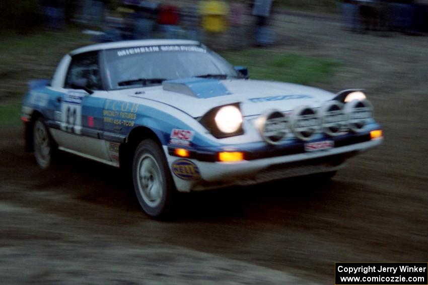 The Mike Hurst / Rob Bohn Mazda RX-7 at speed at the sweeper at the crossroads.