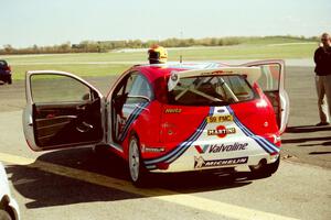 Ford Focus WRC on the tarmac open for viewing.