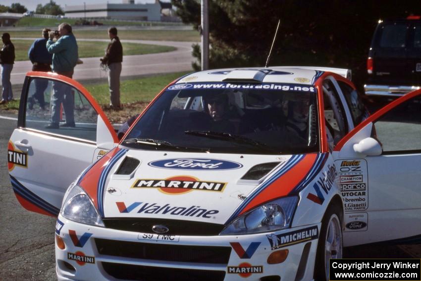 Jim Konkler belts in for a ride with Thomas Rådström.