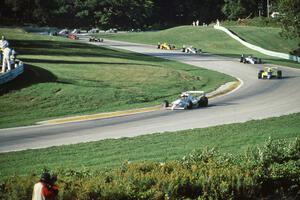 The field streams through turns 6 and 7 on the first lap.