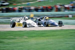 Chris Smith's (27) Ralt RT-5 and Kim Campbell's (11) Ralt RT-5 head uphill side-by-side