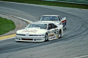 Jerry Brassfield's Olds Cutlass Supreme and Wayne Akers' Ford Mustang