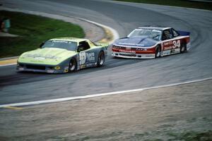Bruce Nesbitt's Chevy Camaro and Walter Payton's Olds Cutlass Supreme