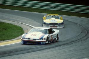 Irv Hoerr's Olds Cutlass Supreme ahead of Tommy Kendall's Chevy Beretta