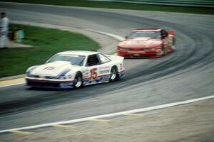 Irv Hoerr's Olds Cutlass Supreme ahead of Darin Brassfield's Olds Cutlass Supreme