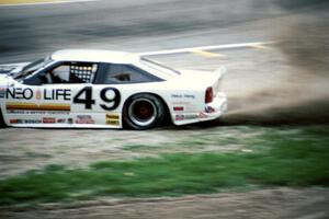 Jerry Brassfield's Olds Cutlass Supreme gets back onto the track just prior to colliding with Paul Newman's similar car.