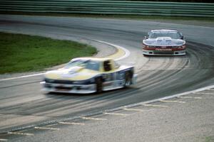 Tommy Kendall's Chevy Beretta leads Scott Sharp's Olds Cutlass Supreme