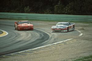 The Olds Cutlass Supremes of Darin Brassfield and Scott Sharp get back under way after spinning