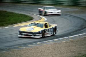 Tommy Kendall's Chevy Beretta and Wayne Akers' Ford Mustang