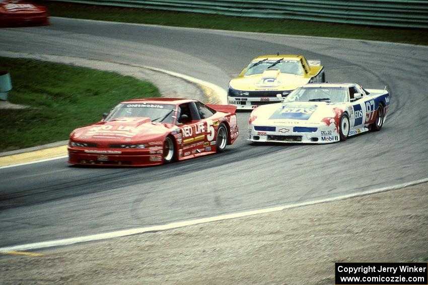 Darin Brassfield's Olds Cutlass Supreme, Scott Lagasse's Chevy Corvette and Tommy Kendall's Chevy Beretta