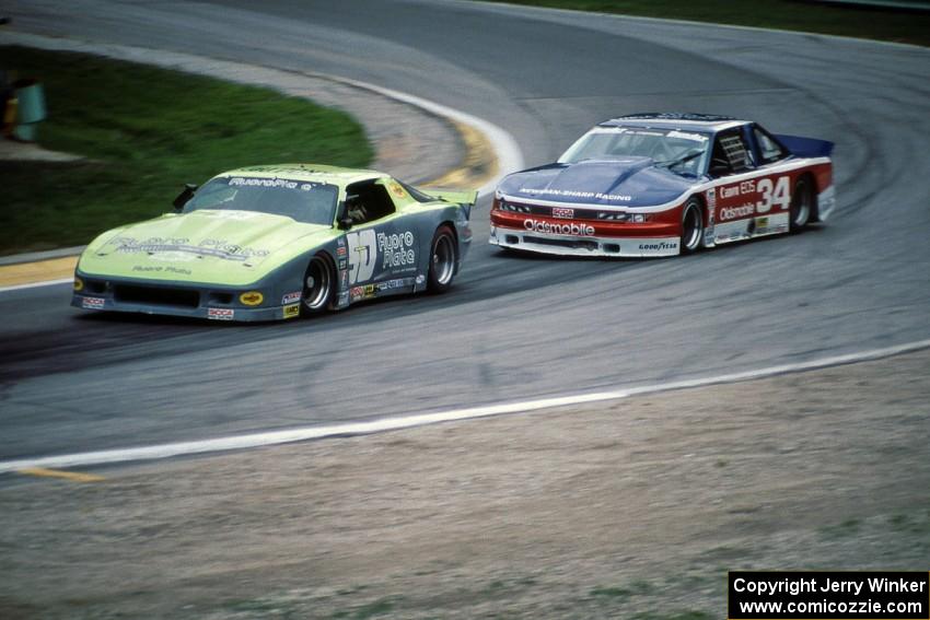 Bruce Nesbitt's Chevy Camaro and Walter Payton's Olds Cutlass Supreme