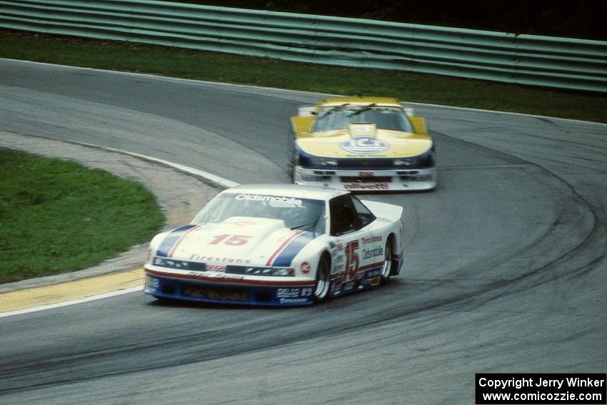 Irv Hoerr's Olds Cutlass Supreme ahead of Tommy Kendall's Chevy Beretta