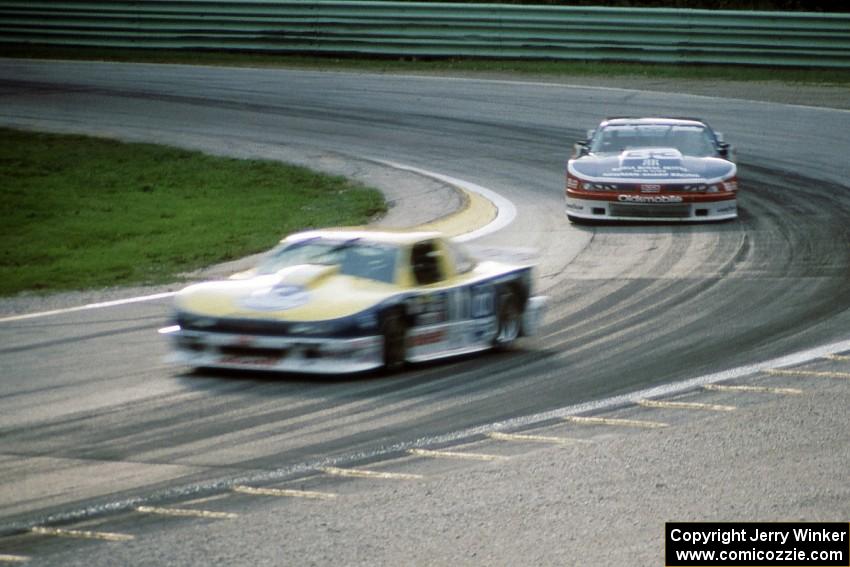 Tommy Kendall's Chevy Beretta leads Scott Sharp's Olds Cutlass Supreme