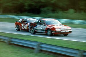 David Daughtery's Olds Quad 442 and Tommy Archer's Eagle Talon battle into turn 5