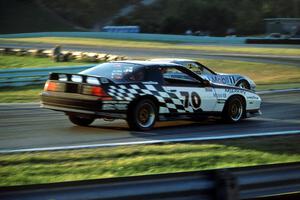 Andy Pilgrim's Chevy Corvette makes an inside pass on Lou Gigliotti's Chevy Camaro