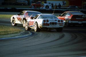 Chris Neville's Chevy Camaro, R.K. Smith's Chevy Corvette and Jim Dentici's Honda CRX Si at turn 5
